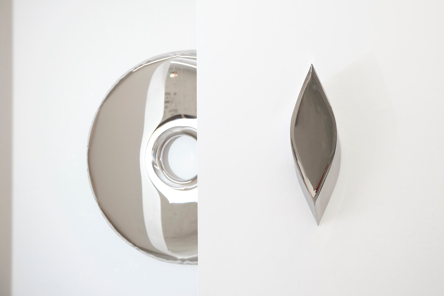 Photo: Federico Floriani. donut shaped mirror made of steel and wall decoration by zieta studio